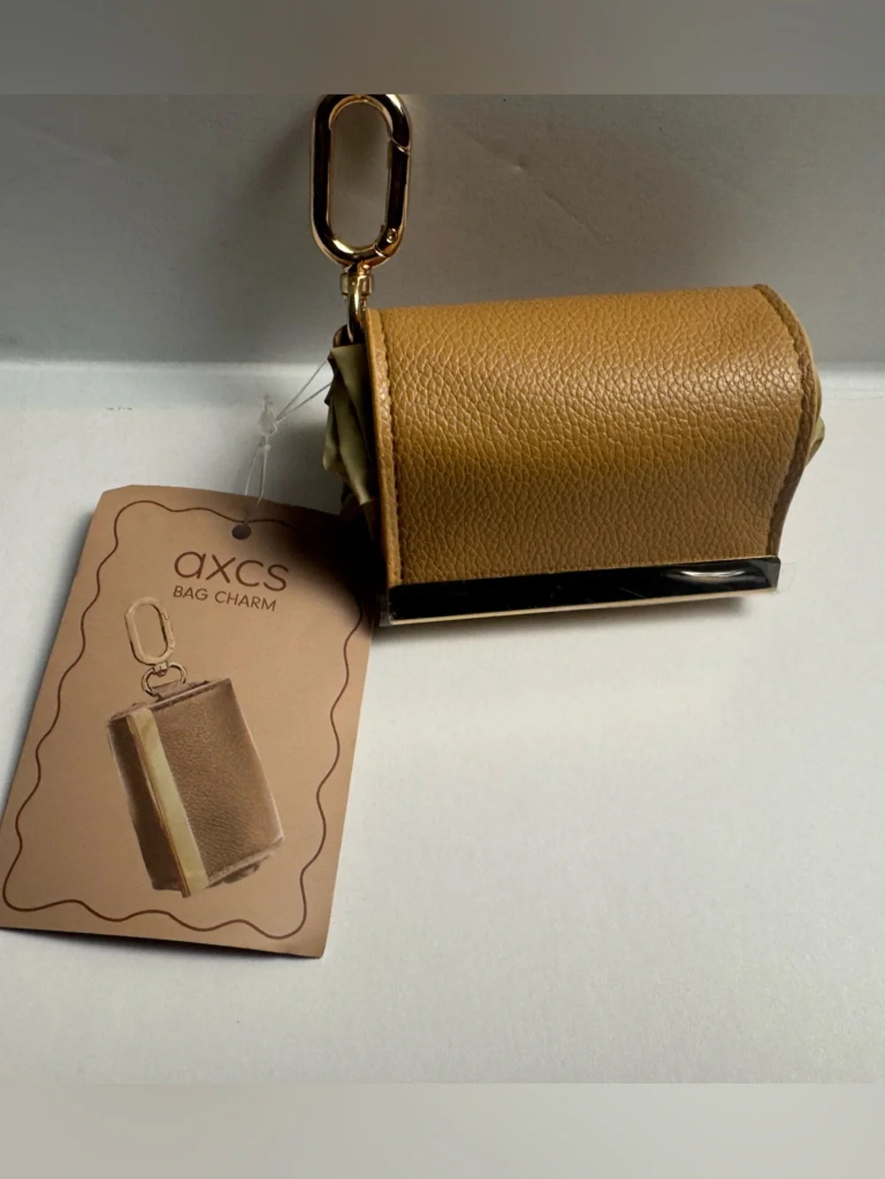A foldable tote bag charm with carabiner clasp for easy use of reusable bag. - Picture 4 of 7